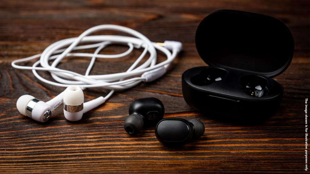 earphones on a wooden table
